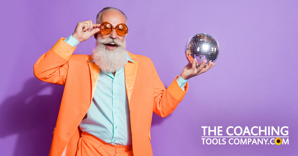 Man in Orange Suit Holding Disco Ball Marketing!