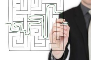 Business Coaching Tools shown by Man Finding Way out of maze