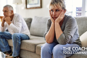 Couple arguing on sofa feeling disconnected