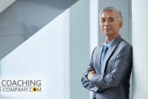 Happy Client in suit leaning against wall