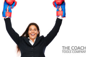 Happy Motivated Woman wearing boxing gloves