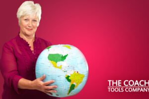 retiree holding globe against red background