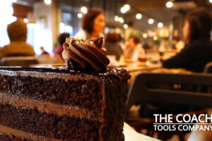 Cake with Coach and Client in background