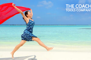 Happy Coach on Beach Having Fun for Wheel of Life!