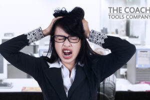 Woman in office tearing hair out!