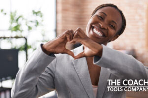 Business Woman making heart shape with hands for loving kindness meditation