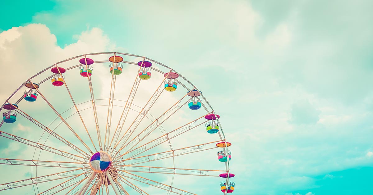 Colourful Ferris Wheel against Blue Sky