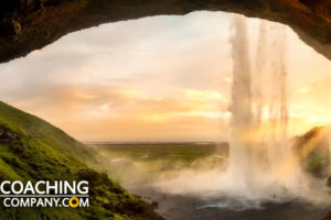 Looking out of cave in iceland - showing awe & wonder in coaching