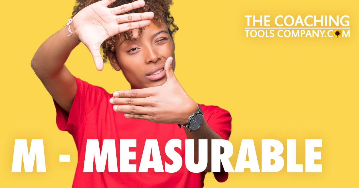 Client squinting trying to size up with hands for M - MEASURABLE