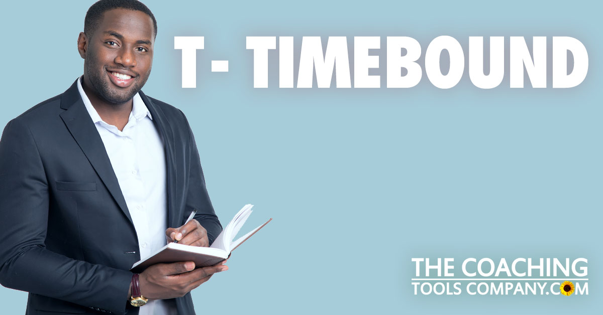 Coach with pen and diary adding deadlines to their Goals for T - TIMEBOUND