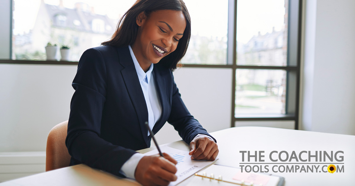 Client Setting Goals at desk for Why Set Goals article