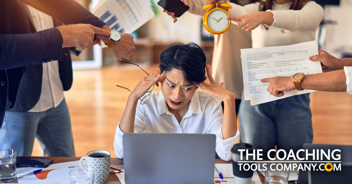 Stressed Manager at desk not setting boundaries