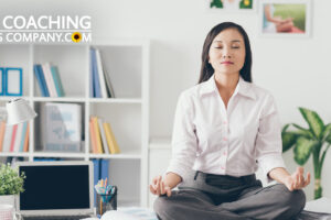 Client or Coach building motivation by sitting on desk meditating