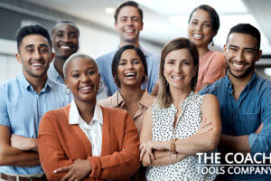 Diverse happy team in office smiling at camera